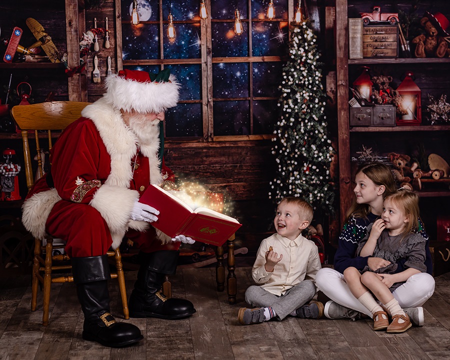 santa reading a story to three siblings in Rolesville NC